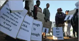  ?? PICTURES: TRACEY ADAMS ?? Women protest outside the Strand Magistrate’s Court during the appearance of Xolani Lantu, 35, accused of the murder, kidnapping and rape of 5-year-old Minentle Lekhatha.