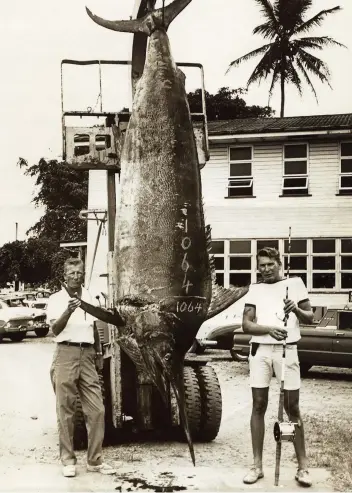  ??  ?? The fish that started it all: Capt. George Bransford (above, on left) and deckhand Richard Obach with a 1,064-pound worldrecor­d black. Capt. Dennis “Brazzaka” Wallace and actor Lee Marvin hooked up on Sea Venture (top right). Capt. Peter Bristow built and skippered Avalon on the reef for many seasons (above right).