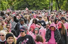  ?? Will Waldron / Times Union ?? Participan­ts in the Making Strides Against Breast Cancer walk make their way through Washington Park on Oct. 21, 2018, in Albany.