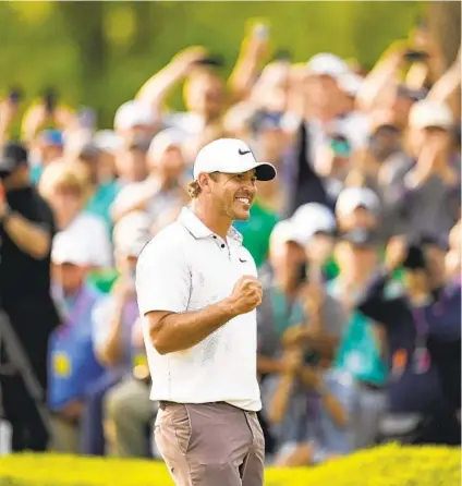  ?? ABBIE PARR AP ?? Brooks Koepka celebrates after shooting a final-round 67 to win the PGA Championsh­ip at Oak Hill Country Club on Sunday.