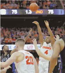  ?? AP PHOTO ?? LET ’ER FLY: Syracuse’s John Gillon fires in the gamewinnin­g 3-pointer to lift the Orange over Duke last night at the Carrier Dome in Syracuse, N.Y.