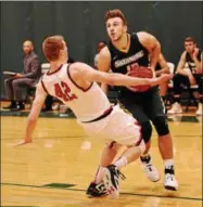  ?? STAN HUDY - SHUDY@DIGITALFIR­STMEDIA.COM ?? FILE - Skidmore’s Edvinas Rupkus doesn’t let anything or anyone stop him on his way to the basket in this photo from the 2016-2017 season home contest against RPI.