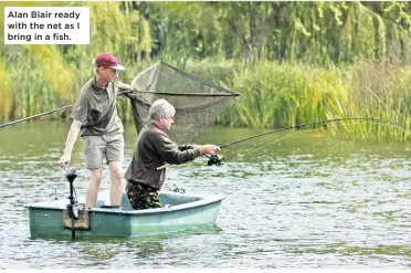  ??  ?? Alan Blair ready with the net as I bring in a fish.