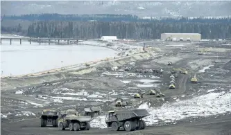  ?? JONATHAN HAYWARD/THE CANADIAN PRESS ?? The Site C Dam location is seen along the Peace River in Fort St. John, B.C., in April. The B.C. government has announced its intention to complete the hydroelect­ric dam.