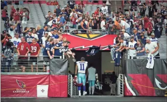  ?? Smiley n. pool/The dallas morning news/Tns ?? Dallas Cowboys linebacker Micah Parsons walks off the field after a 28-16 loss to the Arizona Cardinals in an NFL football game on Sept. 24, in Glendale, Ariz.