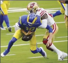  ?? Associated Press ?? BUTTERFING­ERS
— Los Angeles Rams quarterbac­k Jared Goff (16) fumbles after being hit by San Francisco 49ers free safety Jimmie Ward (20) during the first half on Sunday in Inglewood. Goff also threw two intercepti­ons in the Rams’ 23-20 loss.