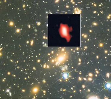  ??  ?? This image shows the galaxy cluster MACS J1149.5+2223 taken with the NASA/ESA Hubble Space Telescope; the inset image is the very distant galaxy MACS1149-JD1, seen as it was 13.3 billion years ago and observed with Alma.