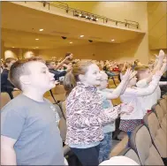  ?? Rachel Dickerson/The Weekly Vista ?? Cooper Elementary School students sing "Fanga Alafia," a traditiona­l West African welcome song with choreograp­hy, during March Musical Madness on Friday at Erand Arts Center.
