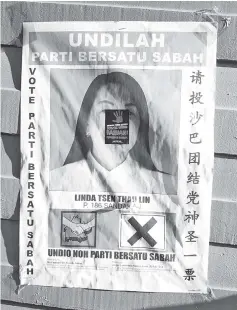  ??  ?? A sticker with the words ‘RASUAH! PEMUSNAH BANGSA!’ was found on one of the posters.