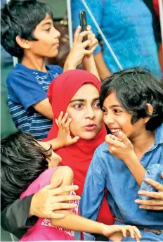  ??  ?? Mom and writer: Zeneefa with her children at the Gratiaen Shortlist event. Pic by M.A. Pushpa Kumara