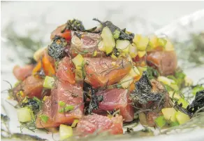  ??  ?? Fresh flavours from the ocean are the key to poke, says chef Tom Muromoto of Ka’anapali Beach Hotel in Maui, Hawaii.