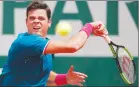  ?? Canadian Press photo ?? Canada's Milos Raonic plays a shot against Spain's Pablo Carreno Busta during their fourth round match of the French Open tennis tournament at the Roland Garros stadium, in Paris, France. Sunday, June 4.