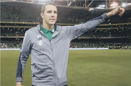 ??  ?? John O’Shea acknowledg­es the Republic of Ireland’s fans after his final game for his country, against the United States, on Saturday.