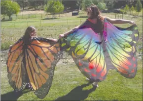  ?? BARB AGUIAR/Special to The Daily Courier ?? Spring Castle and Lily-Jo Trotic show off their colourful butterfly capes they wore to the event.