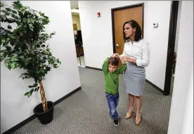  ?? ERIC GAY / ASSOCIATED PRESS ?? Bethany Babcock, co-owner of Foresite Commercial Real Estate, right, stands with her son, Ethan, at her office in San Antonio on July 23. For many small business owners, being a boss means helping staffers when they struggle.