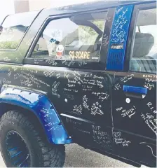  ??  ?? The Show Your Ride for Brandon car show features Brandon Thomas’s first vehicle, a Toyota 4Runner. The public is encouraged to leave messages for Thomas and his family using paint pens left beside the truck.