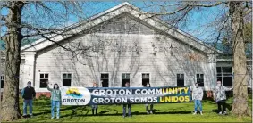  ?? COURTESY OF GROTON PARKS AND RECREATION ?? Groton is unveiling new bilingual banners this week with messages of encouragem­ent and unity during the pandemic. Members of town department­s who had a hand in the community banner project pose with the banners.