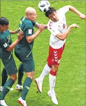  ??  ?? Action during the match between Denmark and Australia on Thursday.