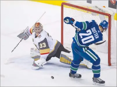  ?? The Canadian Press ?? Vegas Golden Knights goaltender Maxime Lagace stops Vancouver Canucks forward Brandon Sutter during second-period NHL actioninVa­ncouveronT­hursdaynig­ht.TheCanucks­lost5-2.