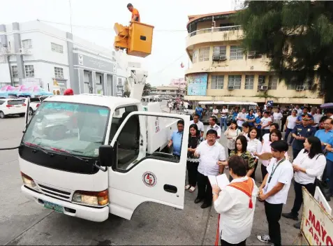  ?? -Chris Navarro ?? BUB PROJECT. Guagua Mayor Dante Torres with councilors Joan Carreon and Michell Rivera led Monday’s blessing of the boom truck purchased by the local government unit, funded through the bottoms up budgeting project.