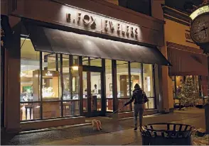  ?? Lori Van Buren / Times Union ?? N. Fox Jewelers on Broadway in Saratoga Springs is seen Monday evening. One of the shop’s employees has tested positive for the highly contagious variant of COVID-19.