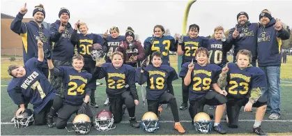  ?? JASON MALLOY/THE GUARDIAN ?? The Cornwall Timberwolv­es won the Papa John’s Football P.E.I. under-12 championsh­ip Saturday in Cornwall. Team members, front row, from left, Griffith Stewart, Cohen Frizzell, Carter Henry, William Keefe, Ethan Duncan and Caden MacAusland. Second row, coach Dallas Kelly, coach Corey Frizzell, Ethan Smith, Marshall Cheverie, Stephen Letner, Carissa Zettle, Owen Lush, Tyler Walker, head coach Richard Lush and coach Jeremiah Henry.