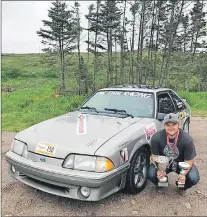  ?? TARGA NEWFOUNDLA­ND PHOTO ?? Andrew Warren poses with his championsh­ip trophies after he and cocompetit­or George Gouzvaris won the overall title in the Targa NL Bambina, which concluded Monday at Parker’s Cove on the Burin Peninsula. Warren is a relative of Cortney Lake, whose...