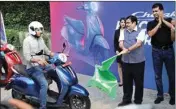  ?? PIC/PTI ?? Union Road Transport and Highway Minister Nitin Gadkari and Managing Director of Bajaj Auto Rajiv Bajaj flag off the Chetak Electric Yatra, in New Delhi, Wednesday