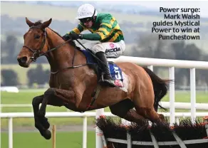  ?? ?? Power surge: Mark Walsh guides Mystical Power to win at Punchestow­n