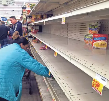  ?? ROBERT HANASHIRO/USA TODAY ?? The shelves were nearly empty of instant soup at this Santa Clarita, Calif., supermarke­t. Shoppers have been buying up water, food and toilet paper, leaving most markets short or out of stock.