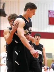  ?? PETE BANNAN — DIGITAL FIRST MEDIA ?? Strath Haven’s John Harrar is hugged by teammmate (14) Jeff Conner after Harrar blocked a Conestoga shot Sunday.