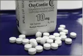  ?? TOBY TALBOT — THE ASSOCIATED PRESS FILE ?? Opioids include prescripti­on drugs such as OxyContin and Vicodin as well as illegal ones like heroin.