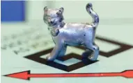  ?? ASSOCIATED PRESS FILE PHOTO ?? The newest Monopoly token, a cat, rests on the game board at Hasbro Inc. headquarte­rs, in Pawtucket, R.I.