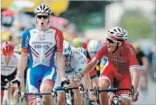  ?? CHRISTOPHE ENA THE ASSOCIATED PRESS ?? France’s Arnaud Demare, left, celebrates after he crosses the finish line first, completing a 171-kilometre leg of the Tour de France on Thursday.