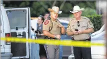  ?? NELL CARROLL / AMERICAN-STATESMAN ?? Investigat­ors gather at the scene where a man, two women and a child were shot to death at the Arbors of Bastrop Apartments on Saturday night.