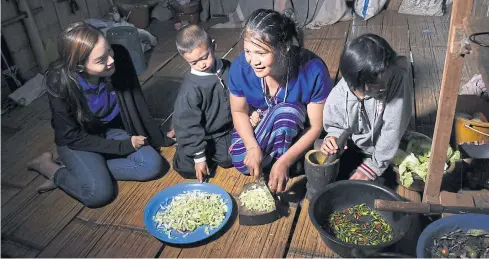  ?? UNDP ?? A solar-powered lantern provides light at a home in a village in Mae Hong Son in northern Thailand, one of many communitie­s in Southeast Asia with low electricit­y connection.