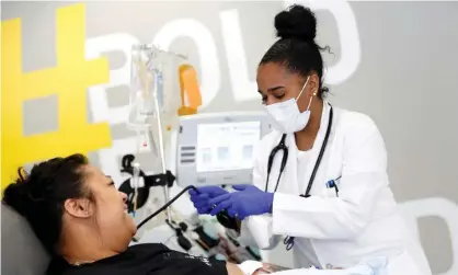  ?? Photograph: Lindsey Wasson/Reuters ?? A woman donates convalesce­nt plasma for an experiment­al Covid treatment study in Seattle.