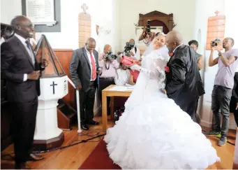  ?? PICTURES: AYANDA NDAMANE ?? WE DO – AGAIN: Grace and Michael Msibi renewed their marriage vows on Robben Island yesterday. Since 2000, the Cape tourist landmark has hosted a special Valentine’s Day wedding ceremony for couples from across the country.
