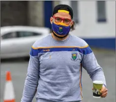  ??  ?? Who is this masked adonis? Spotted approachin­g Aughrim with sculpted torso, Wicklow GAAmask, baseball cap audaciousl­y turned backwards, flowing locks, flame tinted spectacles and clutching what may well be a pumpkin-spiced macchiato or some other newfangled beverage prior to the Wicklow v. Antrim game on Saturday.