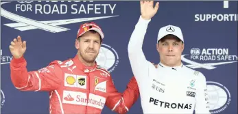  ?? PICTURE: REUTERS ?? POLE POSITION: Mercedes’ Valtteri Bottas, right, celebrates getting pole position with Ferrari’s Sebastian Vettel after yesterday’s Brazil Grand Prix qualifying in Sao Paulo.