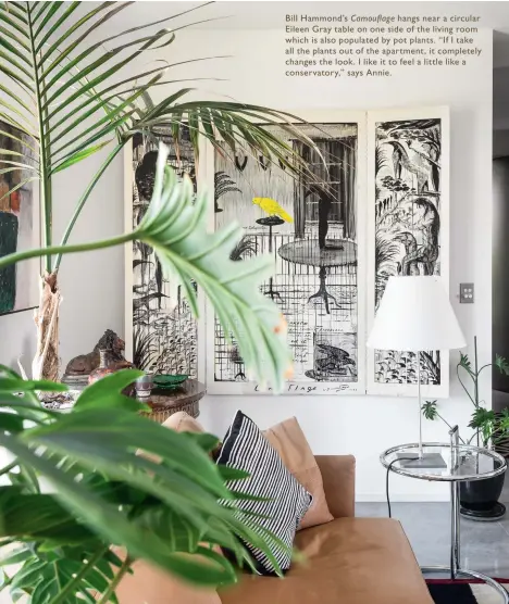  ??  ?? Bill Hammond’s Camouflage hangs near a circular Eileen Gray table on one side of the living room which is also populated by pot plants. “If I take all the plants out of the apartment, it completely changes the look. I like it to feel a little like a...