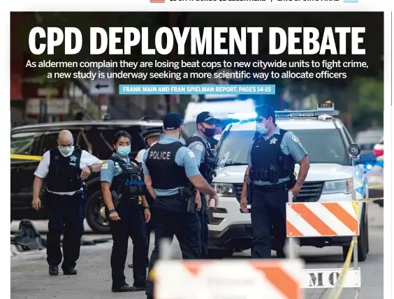  ?? TYLER LARIVIERE/SUN-TIMES ?? Chicago police investigat­e the scene of a shooting in the 1800 block of South Homan in the Lawndale neighborho­od earlier this month.