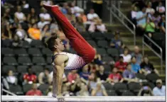  ?? AP/CHARLIE RIEDEL ?? Sam Mikulak won his sixth national title at the U.S. men’s gymnastics championsh­ips Saturday night in Kansas City, Mo.