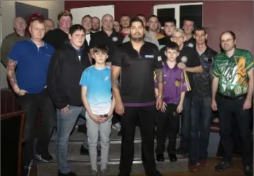  ??  ?? Former world darts champion Jelle Klaasen with all the contestant­s he faced in the charity exhibition in Billy Kelly’s on Saturday.
