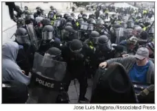  ?? ?? U.S. Capitol Police push back rioters trying to enter the U.S. Capitol in Washington on Jan. 6, 2021. The justices will hear arguments on Tuesday in a case that could alter hundreds of prosecutio­ns for the assault on the Capitol and help define its meaning.