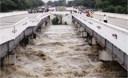  ?? Picture:Reuters ?? TORRENT. The Swar Creek bridge is damaged after flooding at the Yangon-Mandalay express highway in Swar Township, Myanmar, yesterday.