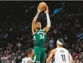  ?? CRAIG MITCHELLDY­ER/AP ?? No surprise, two-time NBA MVP Giannis Antetokoun­mpo and the Bucks are in a tight Eastern Conference race with the first-place Celtics.