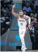  ??  ?? The Nets’ Kyrie Irving reacts.