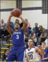  ?? DAVID M. JOHNSON - DJOHNSON@ DIGITALFIR­STMEDIA.COM ?? La Salle’s Raymond Evans (3) hangs in the air during a Colonial Council boys basketball game against Catholic Central Dec. 8, 2017at Catholic High in Troy.