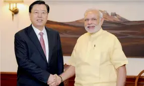  ??  ?? Prime Minister Narendra Modi with Chairman of the Standing Committee of the National People’s Congress of the People’s Republic of China, Zhang Dejiang in New Delhi on Monday. —